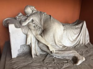 In the Parting Kiss (1889) Sculptor Emilio Quadrelli captures the last farewell of a dying person done in the Realist manner.  He shunned tradition and subscribed to the new ideas of social art at the time.